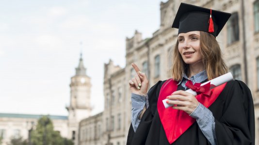 graduation-concept-with-portrait-of-happy-girl-scaled.jpeg